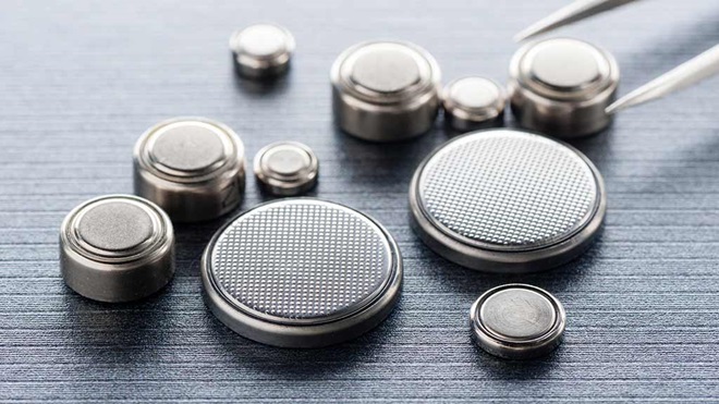 button batteries on grey background